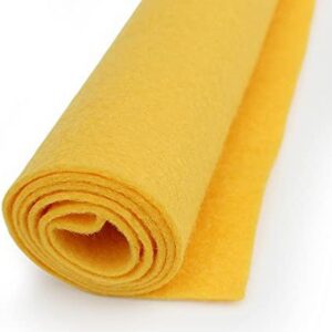 A roll of yellow cloth on top of the floor.