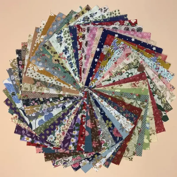 A circle of different colored fabric squares.